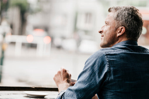 Healthy looking man in his 50s at a coffee shop